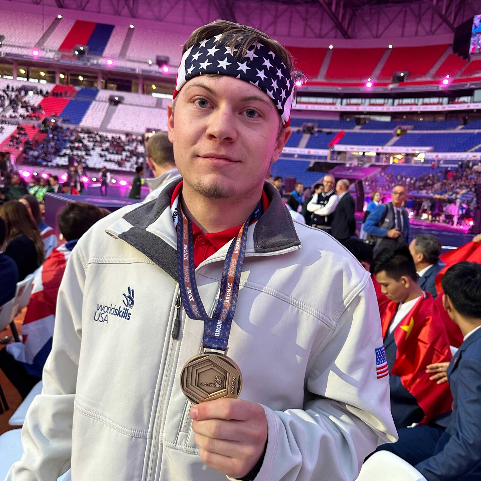 Photo of Wyatt Hansen showing his bronze medallion from the 2024 WorldSkills Competition in Lyon, France.